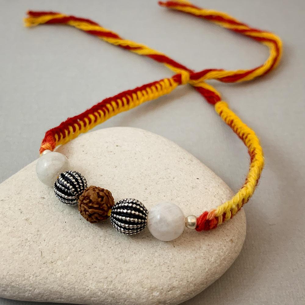 Fourseven Harmony & Balance Healing Gemstone Rakhi with Rainbow Moonstone, Silver and Rudraksha B-0311-SP-S-RBMS Base-Image