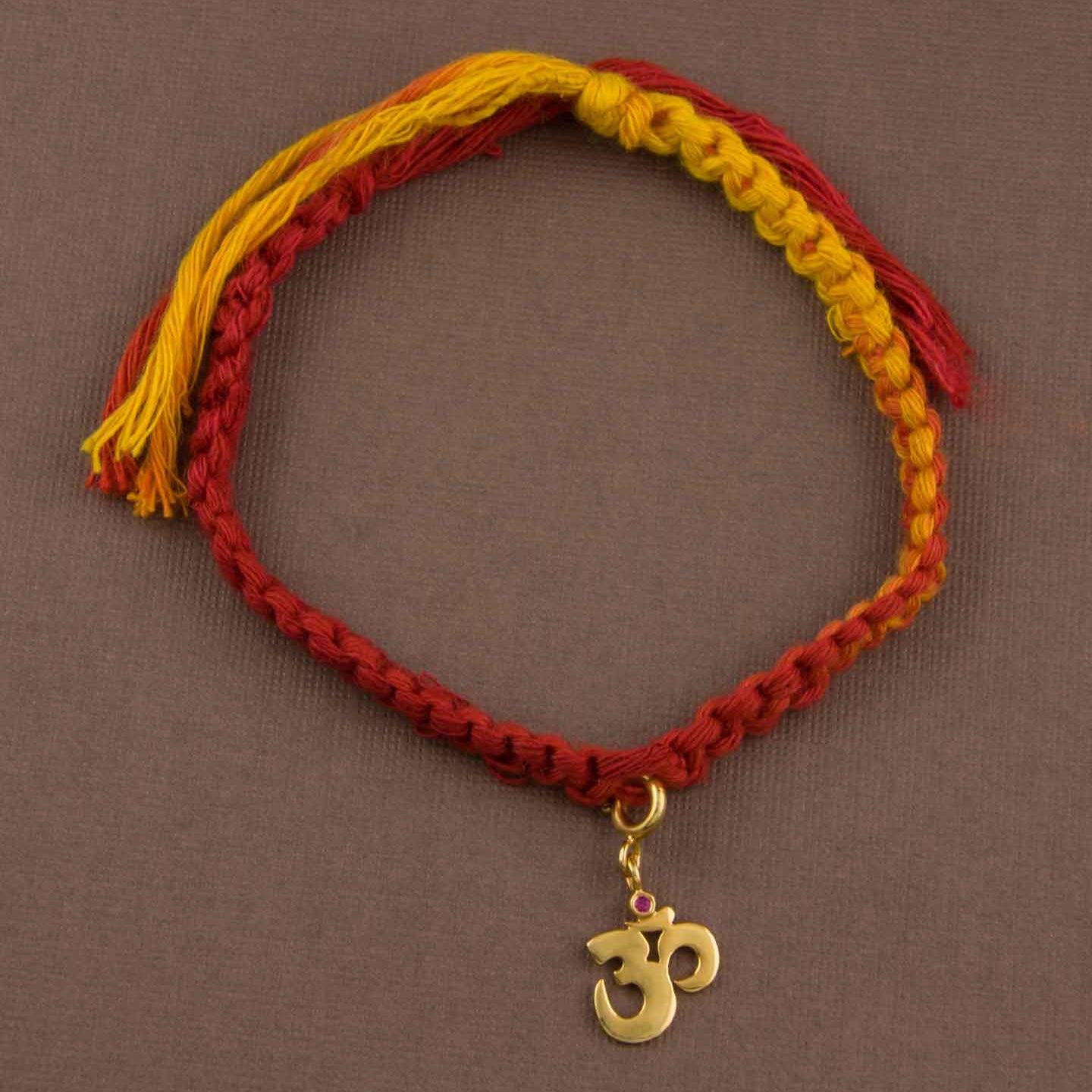 Om Gold-Plated Silver Charm Moli Rakhi Bracelet
