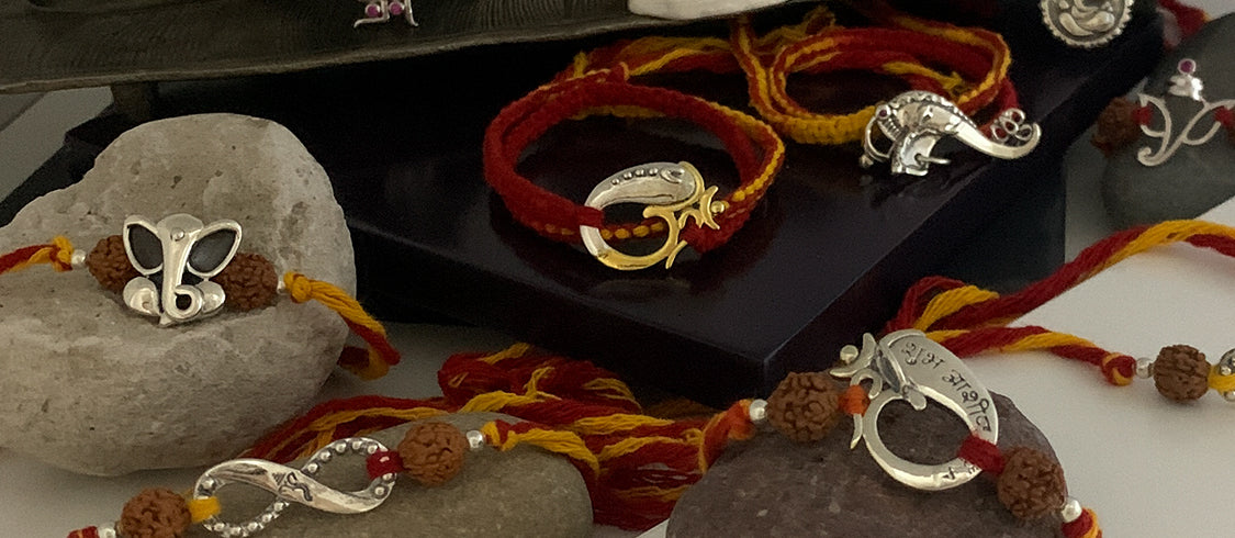 GANESHA Themed Silver Rakhis by Fourseven