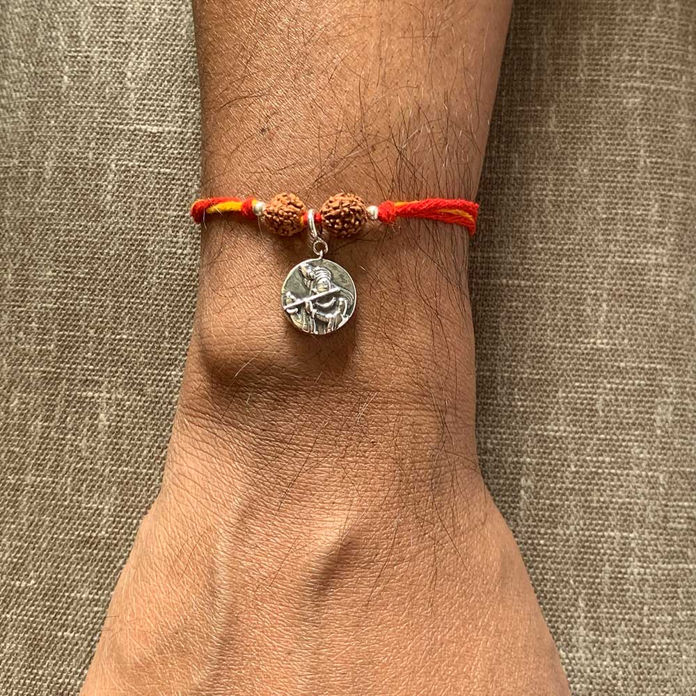 Radha Krishna Aashirwaad Silver Charm Moli Rakhi Bracelet